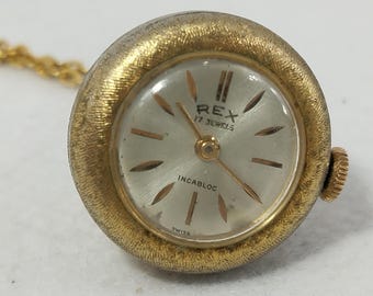 Orologio a pendente meccanico a carica manuale a forma di campana, stile svizzero di metà secolo.