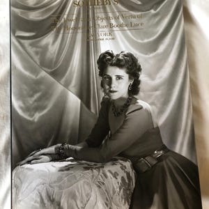May include: Black and white Sotheby's catalog cover featuring a portrait of a woman. The catalog title reads "The Jewel and Objects of Vertu of the Honorable Clare Boothe Luce." The woman is wearing jewelry and a dress.