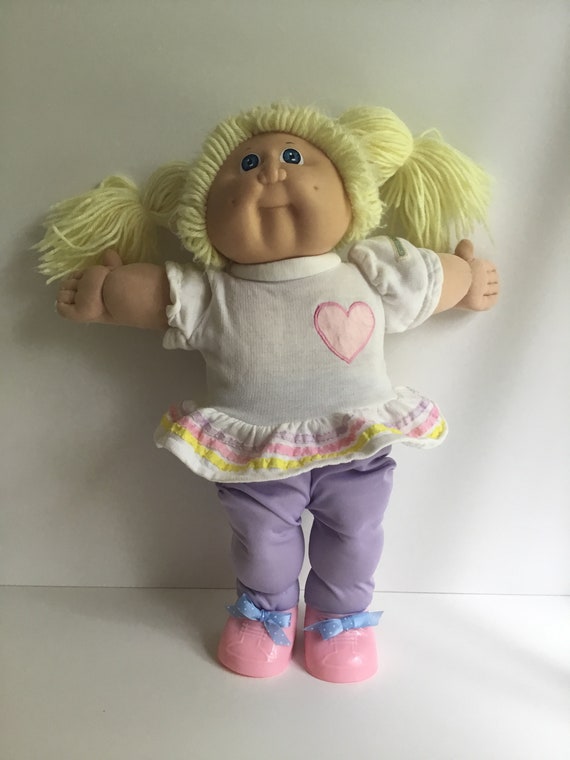 cabbage patch doll with pigtails