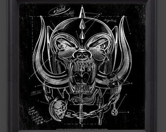 May include: Framed print with a black border, showcasing a silver-toned blueprint-style illustration of a skull with horns and chains. The design includes a spiked helmet and is set against a black backdrop.