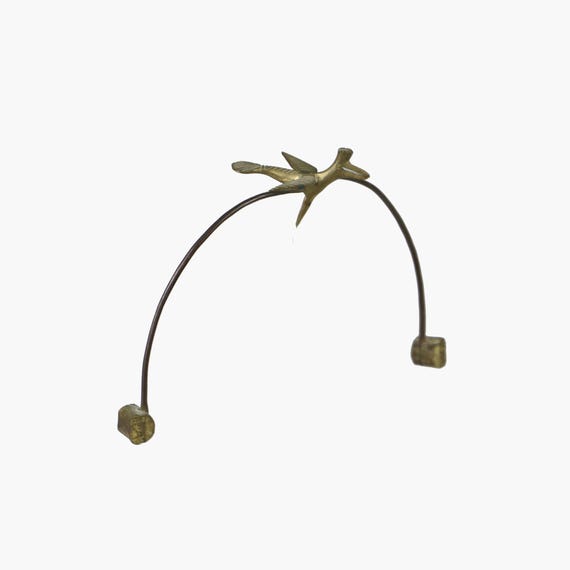 An authentic 1960s mid-century brass bottle-balancing bird — the real vintage deal, not a reproduction.