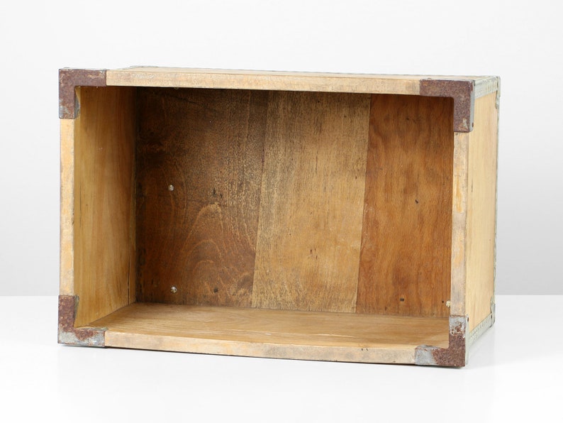 May include: A wooden storage box with metal accents. The box is empty and has a natural wood finish.