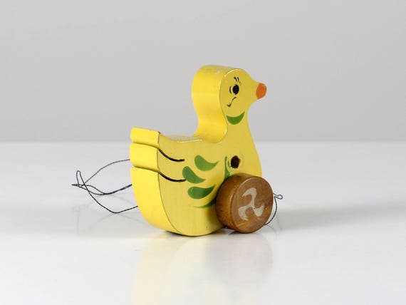wooden toy duck on wheels