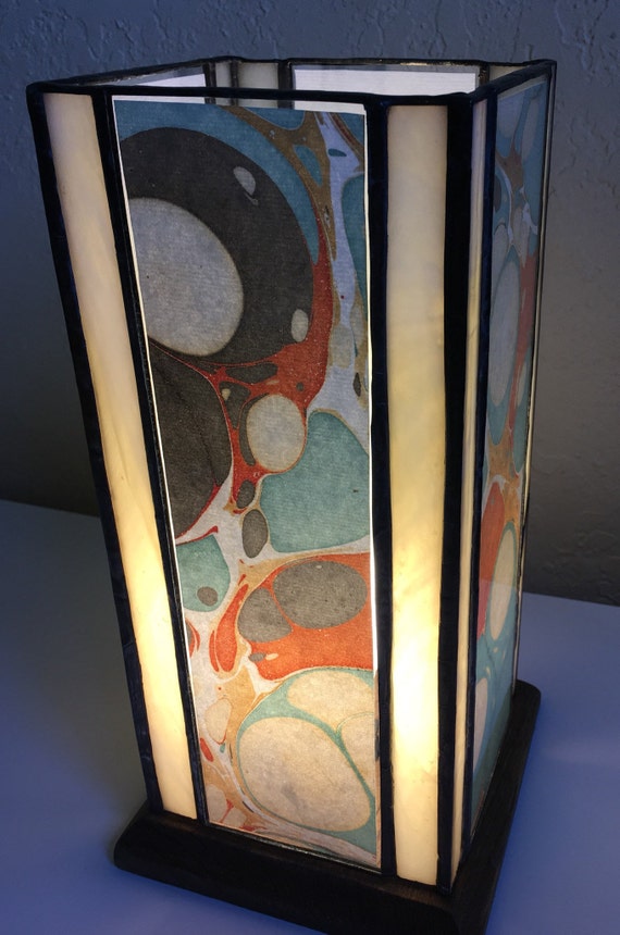 Stained glass table lamp white cream glass with salmon black blue and cream paper encased inside clear glass Stained glass table lamp white cream glass with salmon black blue and cream paper encased inside clear glass