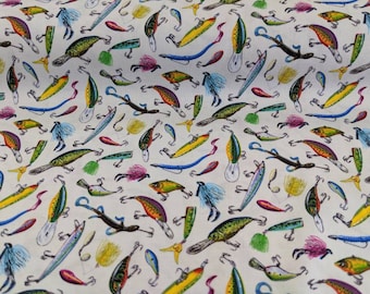 May include: A white fabric with a repeating pattern of colorful fishing lures. The lures are in various shapes and sizes, with some having feathers and others having shiny metallic finishes.