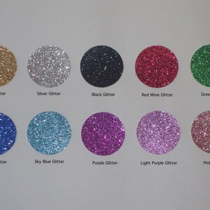 May include: Ten different colors of glitter in round containers. The colors are gold, silver, black, red wine, green, jewel blue, sky blue, purple, light purple, and pink.