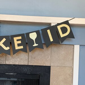 May include: Black and gold banner with the word "KEyID" and a wine glass graphic.