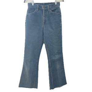 Vintage Levis 100% cotton mid rise faded blue flared denim jeans soft classic orange tab raw hem bell bottom 70s 80s soft straight leg 27&quot;