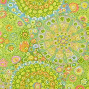 May include: A colorful fabric with a repeating pattern of circles and flowers in shades of green, yellow, pink, and blue.