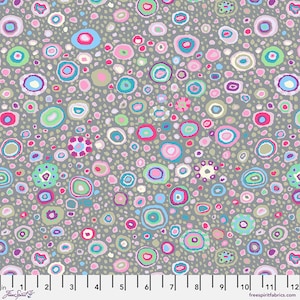 May include: A fabric pattern featuring a repeating design of colorful, abstract circles and dots on a gray background. The circles are in shades of pink, blue, green, and purple. The fabric is marked with inch measurements.