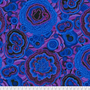 May include: Abstract fabric with a swirling pattern of blue, purple, and black agate-like shapes. The fabric has a textured look and feel.