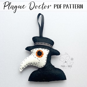 May include: A black felt Plague Doctor ornament with a white beak and orange eye detail. The ornament has a black ribbon for hanging and the text "Plague Doctor PDF Pattern" at the top.
