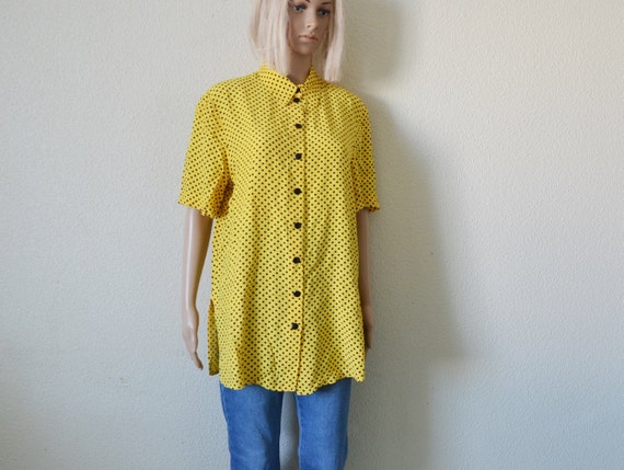 yellow top with black polka dots