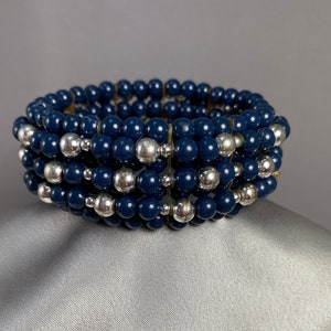 Bracelet//Stretch//Navy blue round beads//Large and small silver beads//7 strands//3 inch diameter unstretched//9 1/2 inches around//Vintage