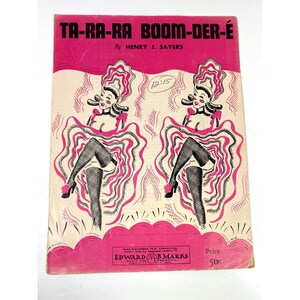 May include: Vintage sheet music cover for "Ta-Ra-Ra Boom-Der-É" by Henry J. Sayers. The cover features a pink and cream color scheme with illustrations of two can-can dancers. The price is 50 cents.