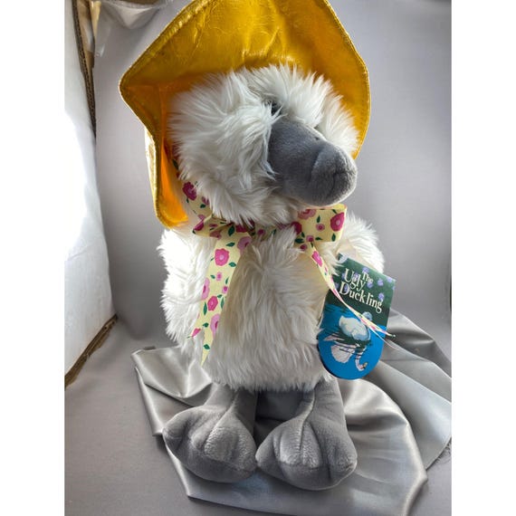 みにくいアヒルの子 ぬいぐるみ絵本 黄色い帽子と花柄のリボン