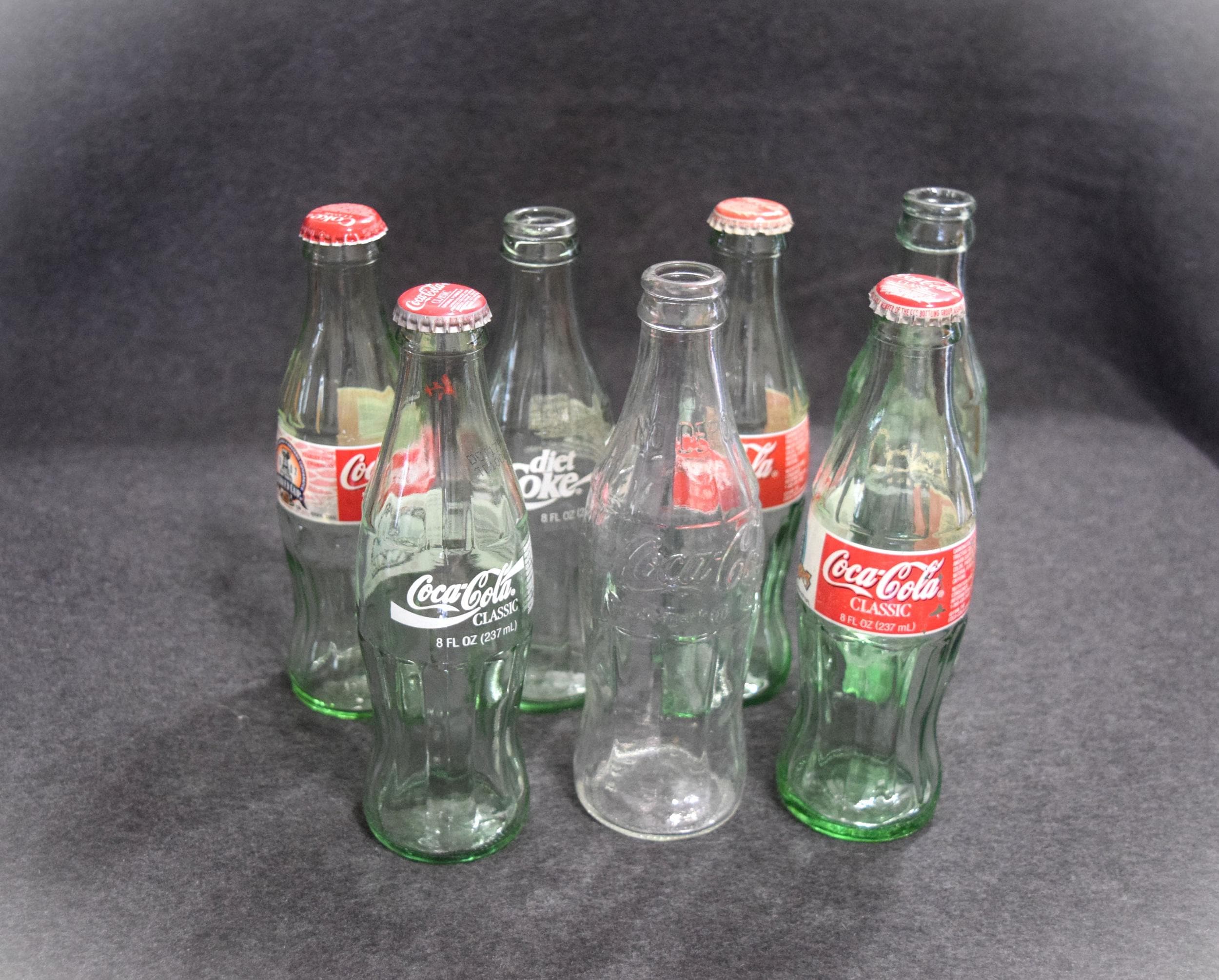 7 Vintage Coca Cola Pop Bottles Green Glass Embossed White Lettering 8 ...