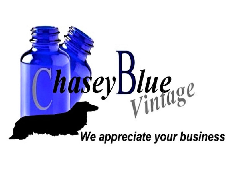 May include: Two blue glass bottles with a black silhouette of a dachshund dog and the text "Chase Blue Vintage" in black and gray lettering. The text "We appreciate your business" is also included in the image.