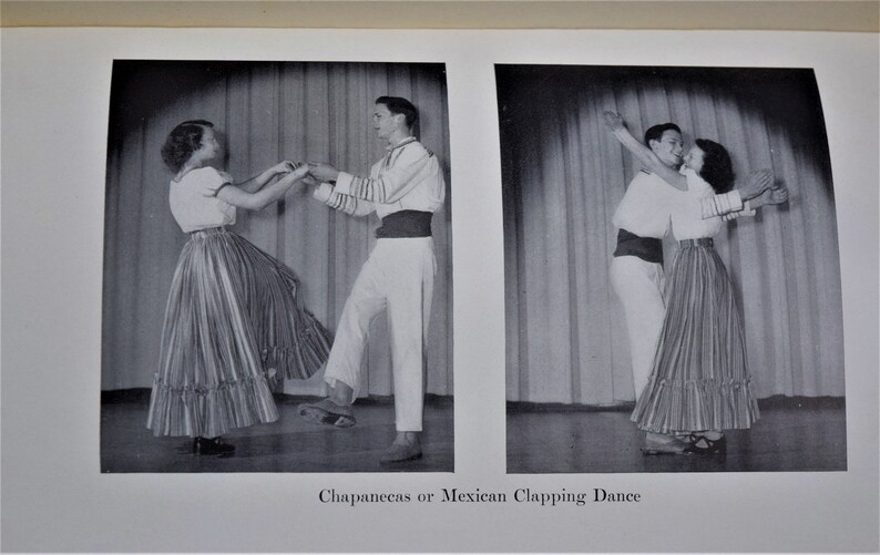 May include: Two people in traditional Mexican clothing are performing a dance called "Chapanecas or Mexican Clapping Dance". The woman is wearing a striped skirt with a ruffle and a white blouse. The man is wearing white pants, a white shirt with a black sash, and a black vest.