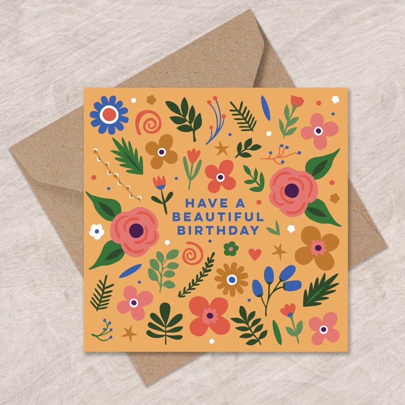 May include: A yellow card with a floral pattern and the text "Have a Beautiful Birthday".