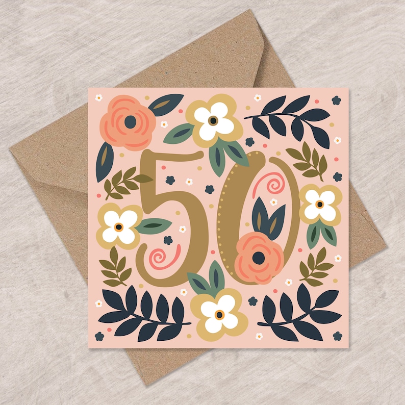 May include: A pink card with a gold number "50" surrounded by floral illustrations. The flowers are in shades of pink, white, and green.