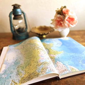 May include: A set of three ceramic mugs with a speckled, matte finish. The mugs are in shades of cream, light gray, and dark gray. Each mug has a simple, minimalist design and a rounded handle.