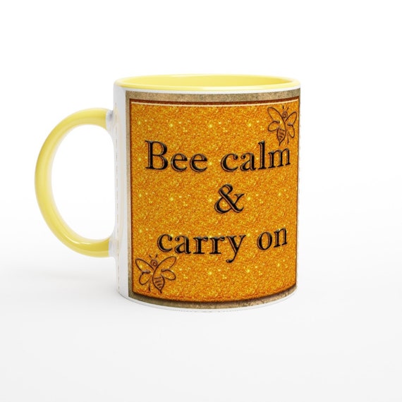 Bee Calm & Carry on White 11oz Ceramic Mug with Yellow handle and interior.
