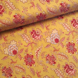 May include: Yellow fabric with a floral pattern featuring red, pink, and blue flowers. The fabric has a repeating pattern of stylized flowers and leaves.