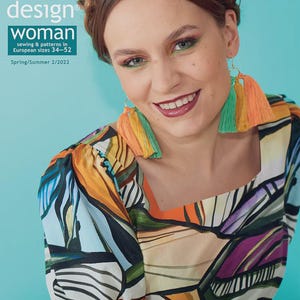 May include: A woman smiles, wearing colourful tassel earrings and a patterned top. The magazine cover features the text "OTTOBRE design woman" with information about sewing patterns in European sizes 34-52 for Spring/Summer 2/2022.