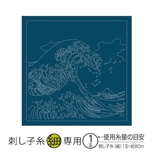 May include: A dark teal square fabric featuring a white embroidered depiction of a large ocean wave, a mountain, and small boats. Japanese text at the bottom indicates it is for sashiko thread.