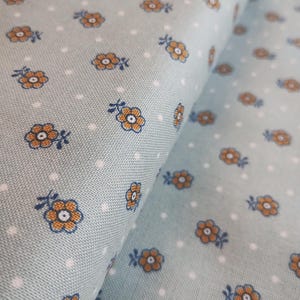 Courtepointe Liberty of London Emporium pour confection de vêtements en coton noir Kingly Sprig en bleu par 50 cm