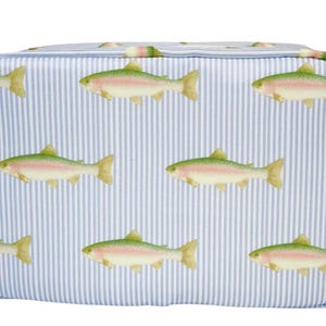 May include: A rectangular cosmetic bag with a blue and white striped background. The bag is decorated with illustrations of rainbow trout. The fish are green, pink, and yellow. The bag has a zipper closure and a small side pocket.