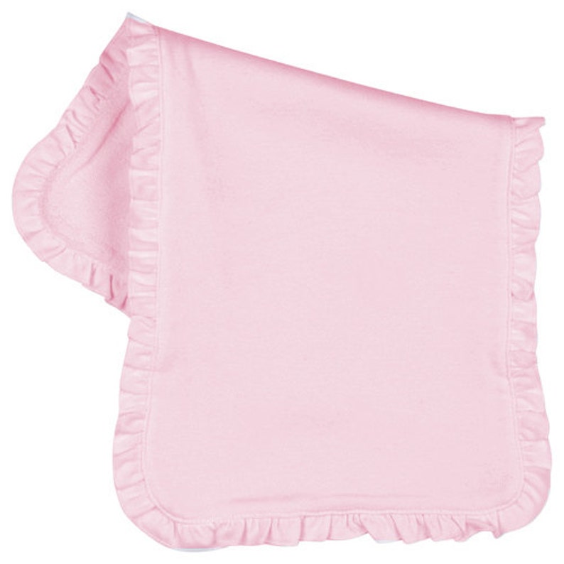 May include: A pink baby blanket with a ruffled edge.