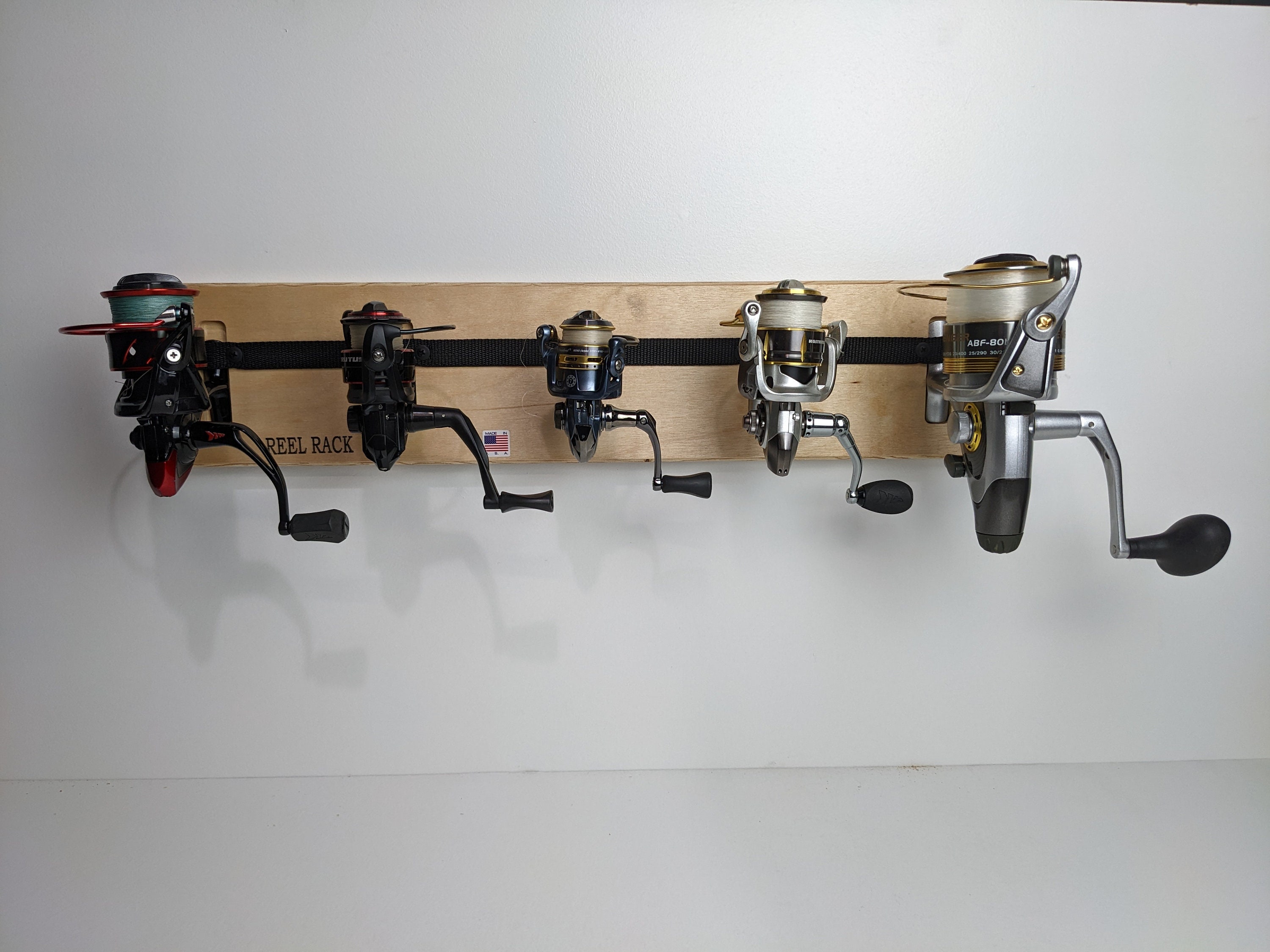 Reel Rack. Custom fishing reel organizer. Spinning fishing reel holder. CNC  cut, hand assembled. 100% made in USA