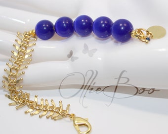 Royal Blue Cat's Eye Bracelet, Fish Spine Gold Chain, classy gold bracelet, statement bracelet, unique bracelet, gold and blue jewelry