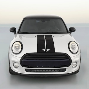 May include: A silver Mini Cooper with black racing stripes down the hood. The car has a black grill and black headlights.