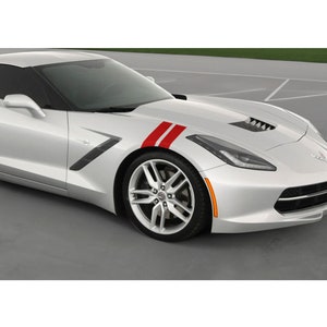 May include: A silver sports car with red racing stripes on the hood. The car has a sleek design with a low profile, alloy wheels, and blacked-out windows. The front of the car features headlights and a front bumper.
