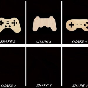 May include: Ten different shapes of wooden game controller cutouts. The shapes are numbered 1 through 10.