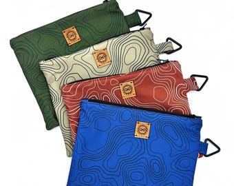 Zip Topo design pouch, Great for organizing your items. Quilted interior for padded protection.