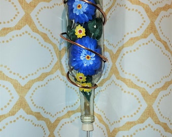 Beautiful hand painted copper wire wrapped wine bottle hummingbird feeder with Cobalt Blue and yellow daisy floral design.