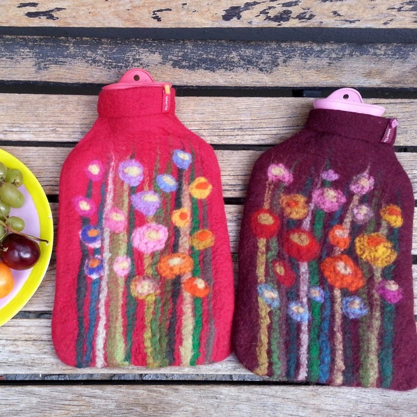 Hot water bottle with felted cover, grass and flowers, red