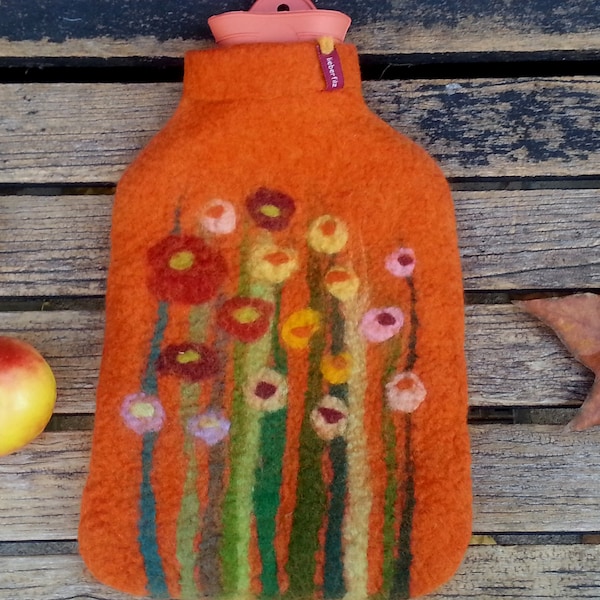 Hot water bottle with felted cover, grass and flowers, orange