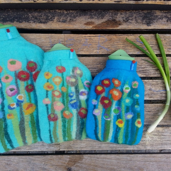 Hot water bottle with felted cover, grass and flowers, turquoise