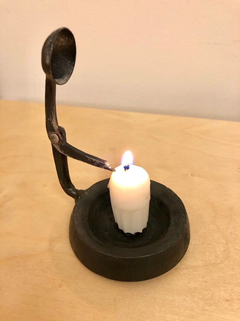 Hand self snuffing candle holder Etsy