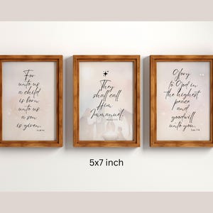 May include: Three 5x7 inch wood framed prints with white backgrounds and black text. The first print says "For unto us a child is born, unto us a son is given". The second print says "They shall call Him Immanuel". The third print says "Glory to God in the highest peace and goodwill unto you".