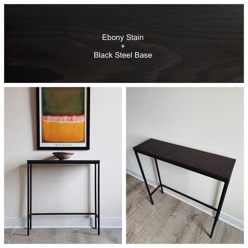 May include: A rectangular console table featuring a dark wood top with an ebony stain and a slim black steel base. The text Ebony Stain + Black Steel Base is visible at the top of the image. The table has four thin legs and a horizontal support bar.