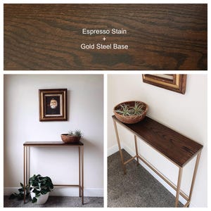 May include: A rectangular console table featuring a dark brown wood top with an espresso stain and a slim gold-colored steel frame base. The text Espresso Stain + Gold Steel Base is visible above the table in the top section of the image.