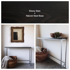 May include: A console table with a rectangular top featuring an ebony stain and a natural steel base. The text Ebony Stain + Natural Steel Base is visible. The table is shown in two views, one with a woven basket and one with a bowl.