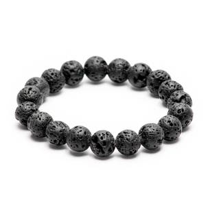 May include: A black lava rock beaded bracelet. The bracelet is made of small, round beads with a rough, textured surface.