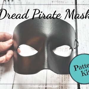 May include: Black leather pirate mask with eye holes. The mask is held in a hand. A blue circle with the text "Pattern Kit!" is in the lower right corner of the image.